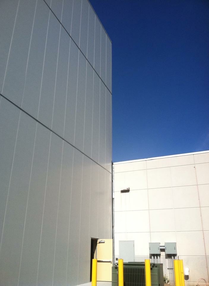Metal panel wall system against blue sky