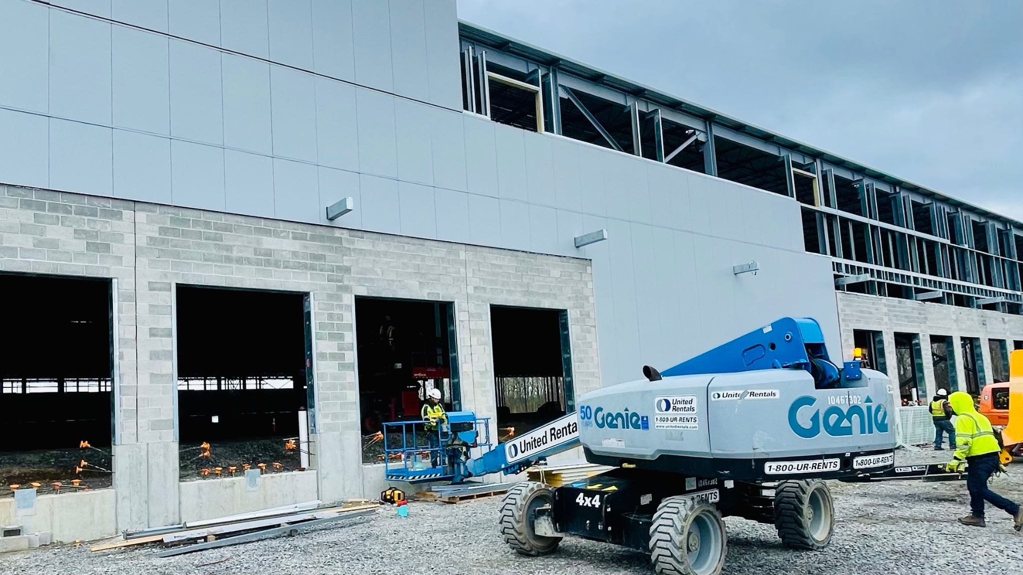 Commercial build with Genie lift and safety crew