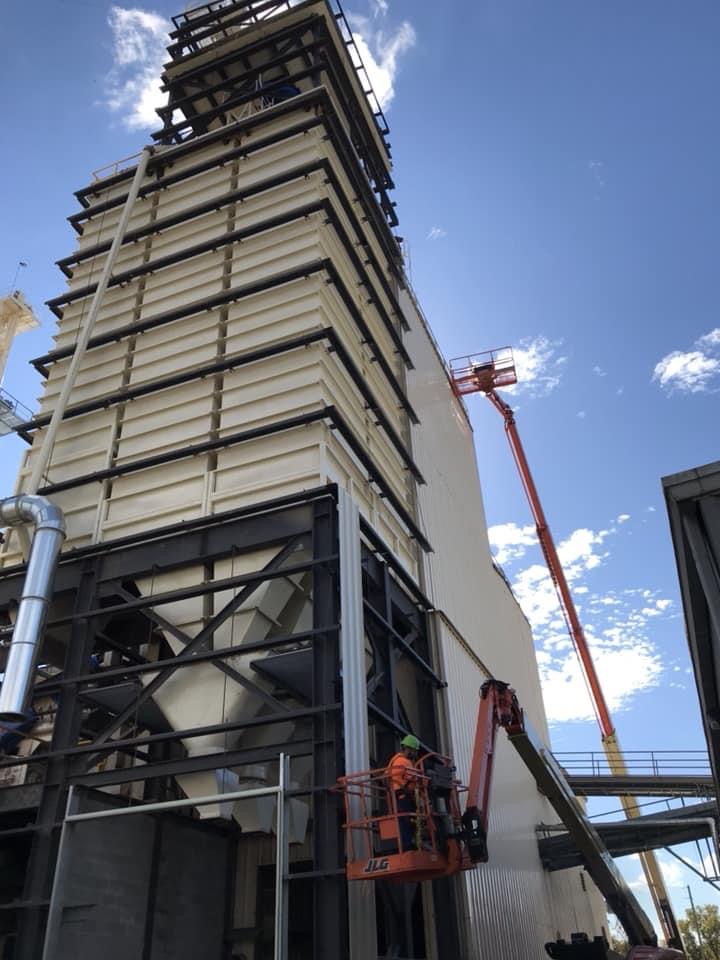 Industrial panel installation on tall structure